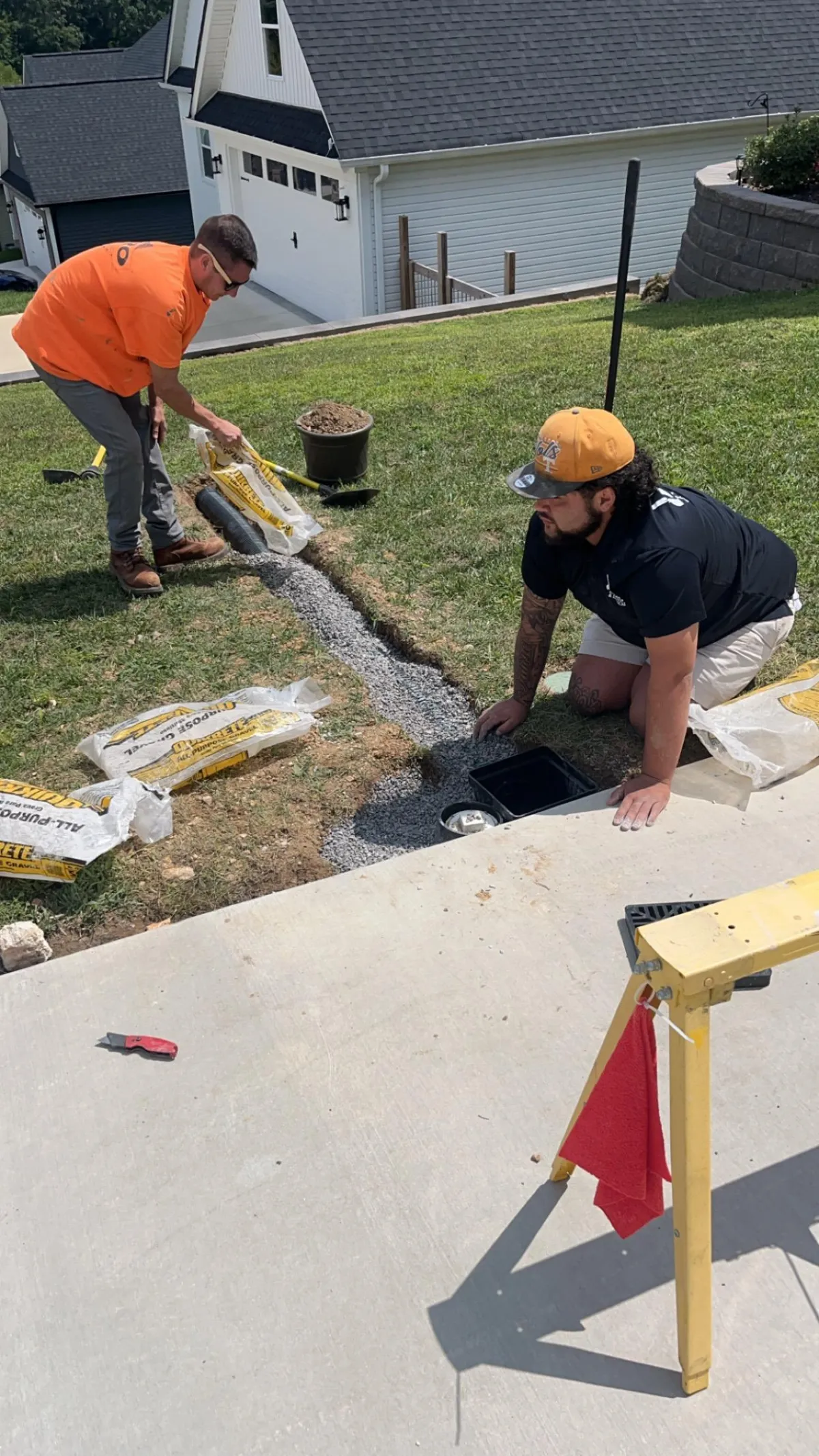 excavator moving dirt on residential property