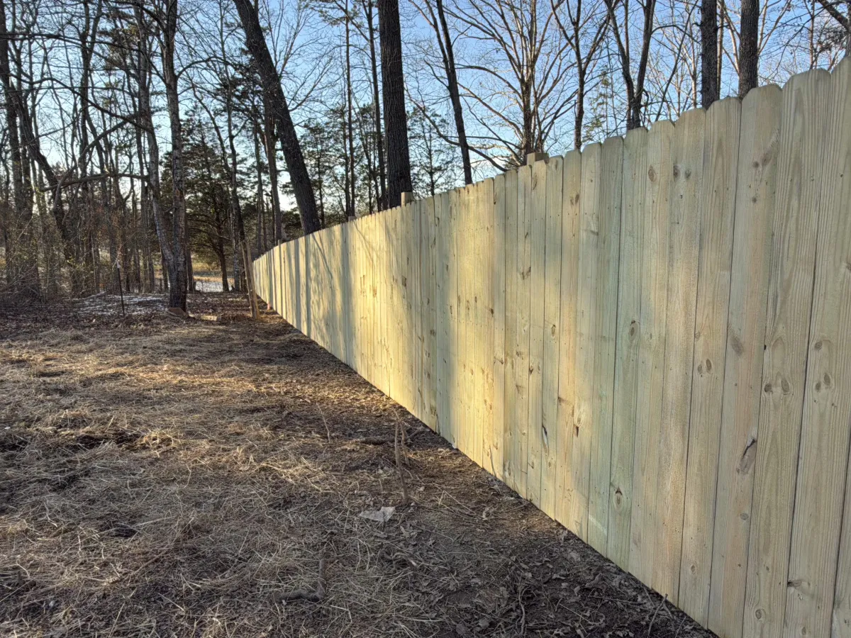 vinyl fence panels installed in backyard