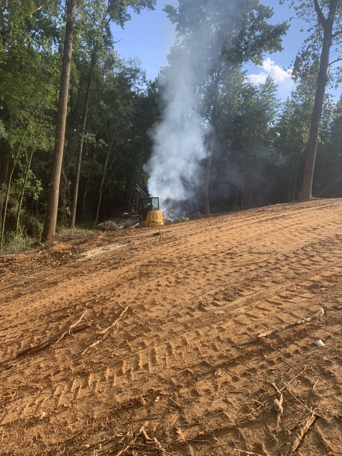 demolition of a small structure using heavy machinery