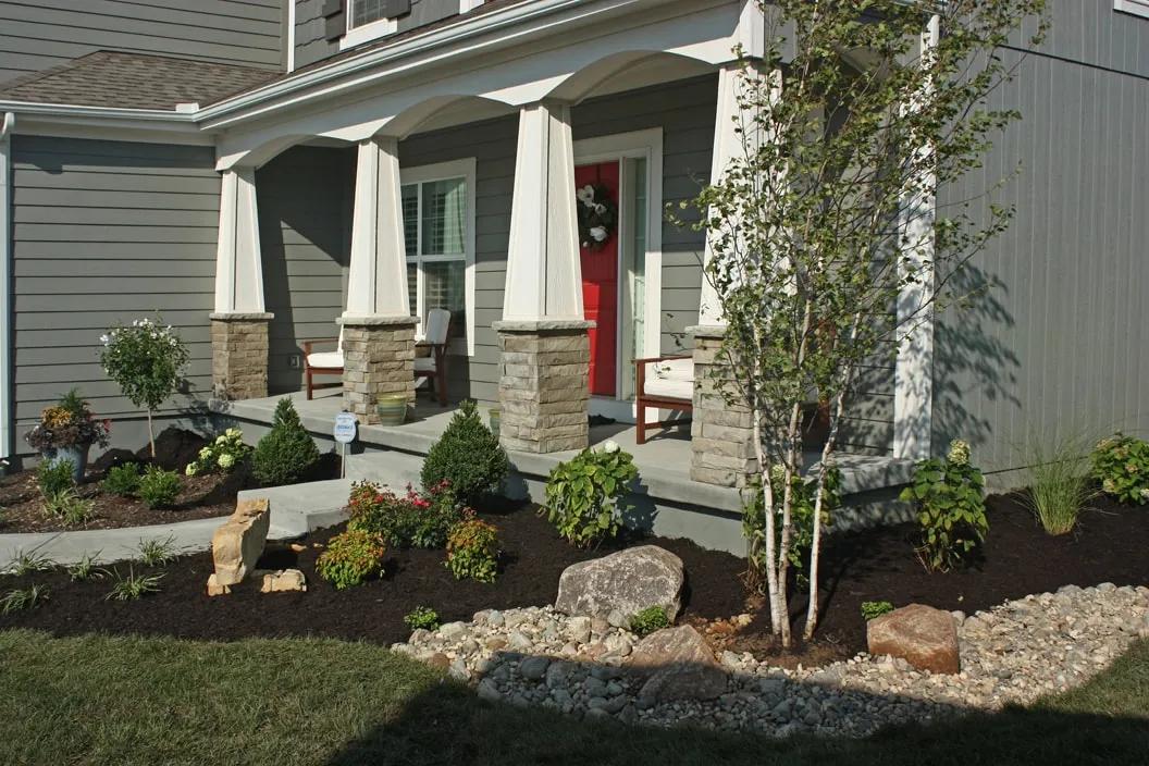 Green Expectations landscaping crew meticulously working on a high-end property in Johnson County