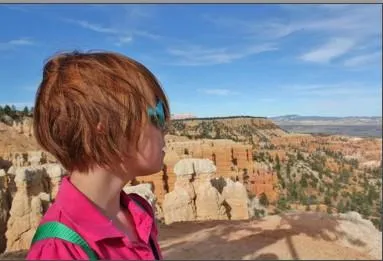 Girl looking out over Bryce Canyon eology