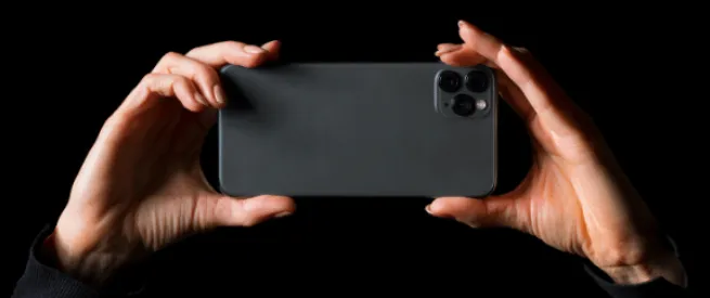 hands holding a smart camera phone