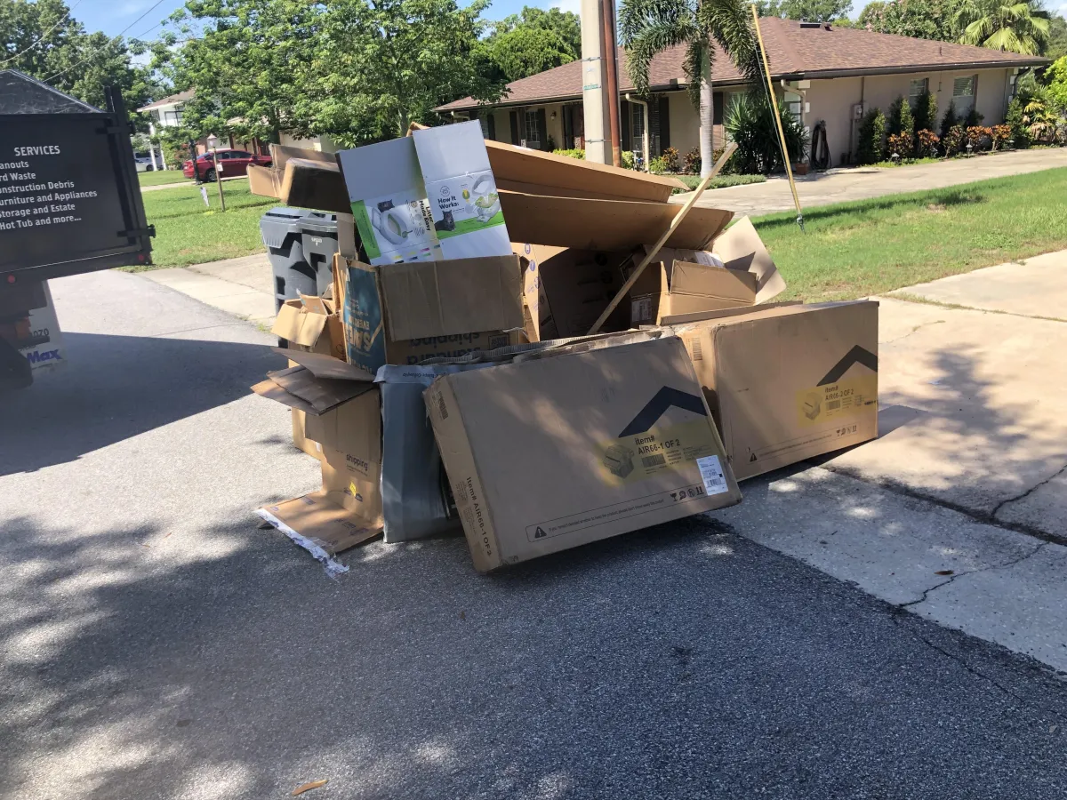 Large recycle boxes curbside overflowing