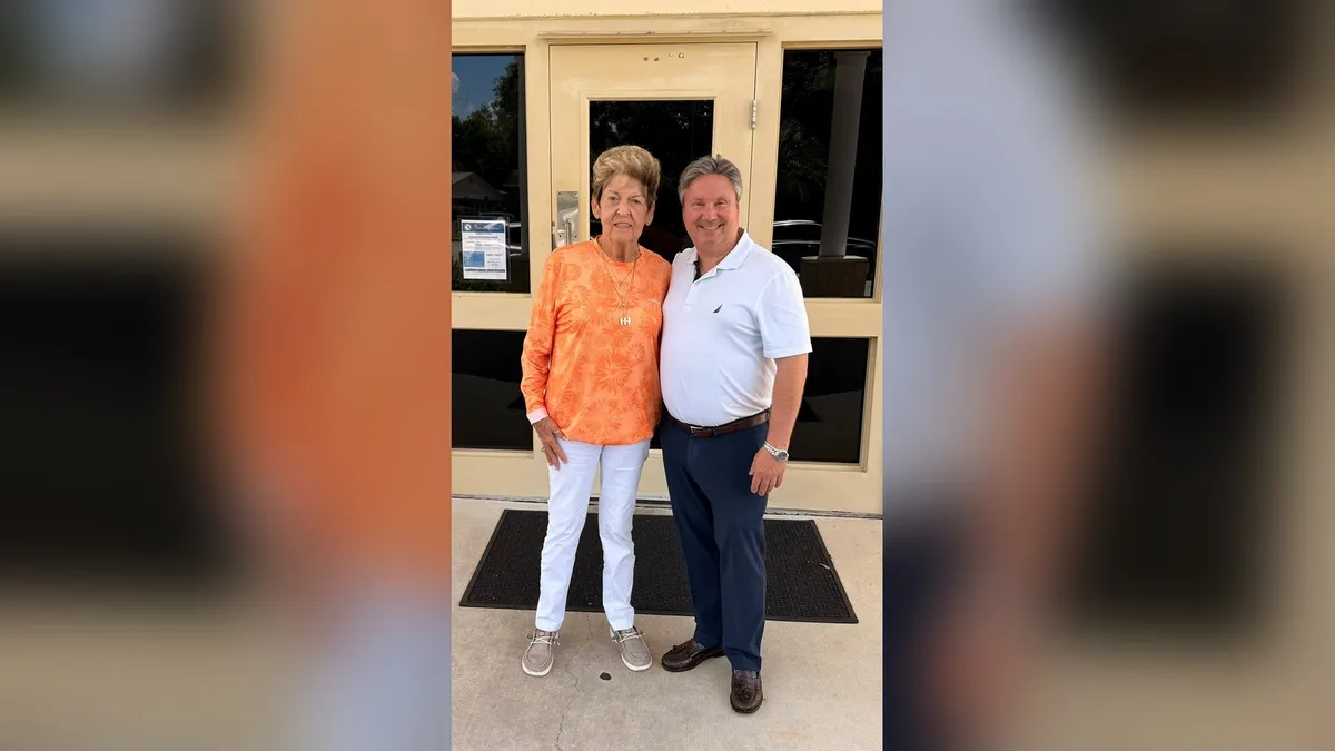 Erik Swenk with Susie Coffman outside the Winter Springs Senior Center