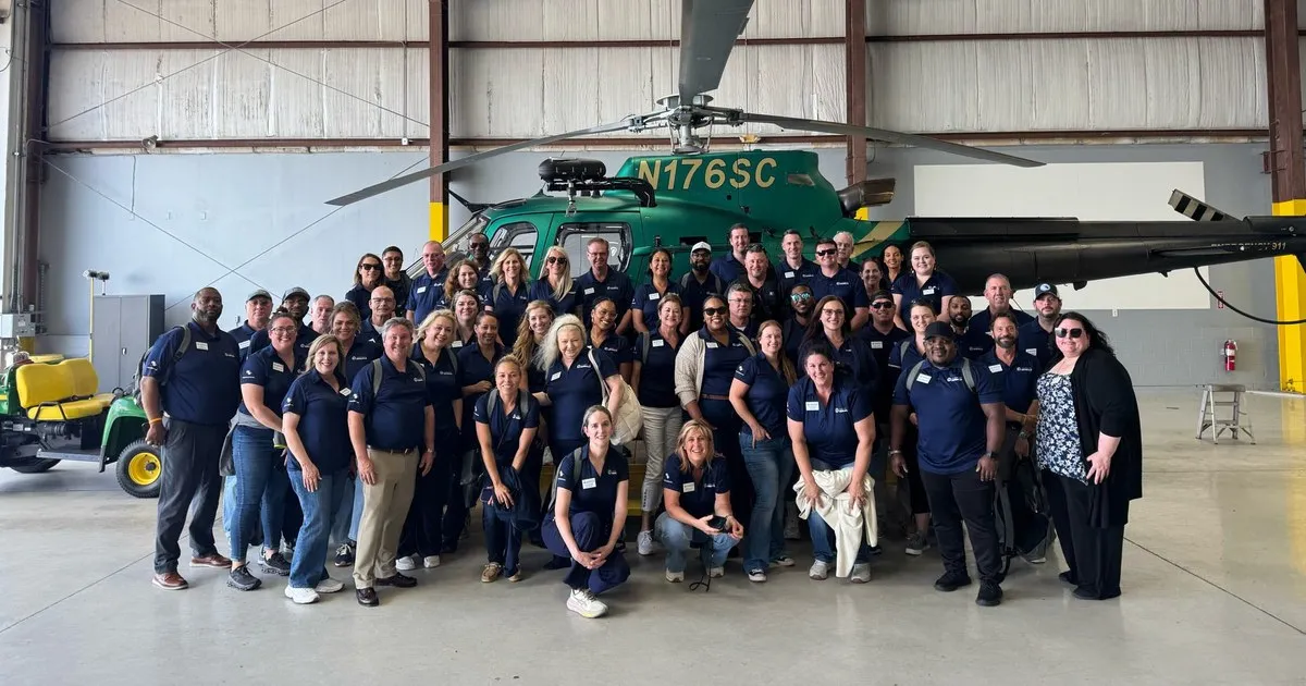 Leadership Seminole Class 35 group photo in front of a Seminole County Sheriff’s Office helicopter