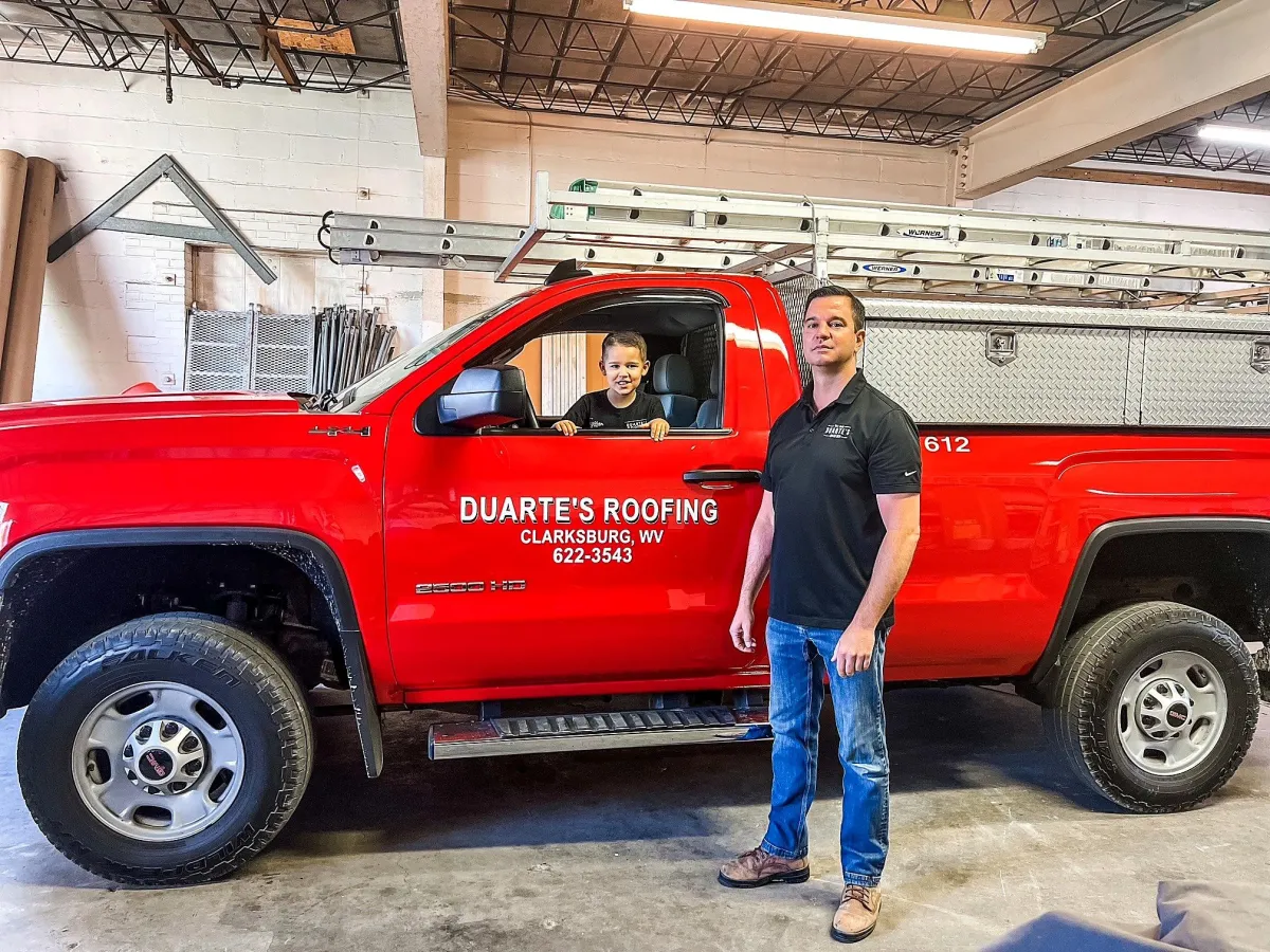 Duarte's Roofing crew working on a black roof