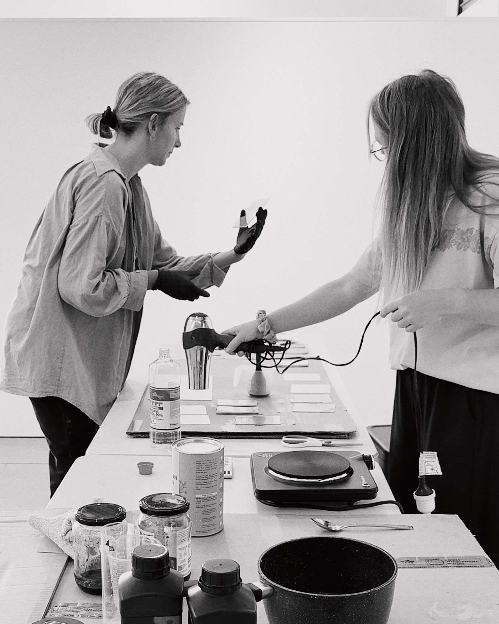 Cyanotype toning book, washing soda crystals, and tea bags laid out for a private cyanotype printing lesson at Halide Studios, showing botanical toning and alternative photography processes