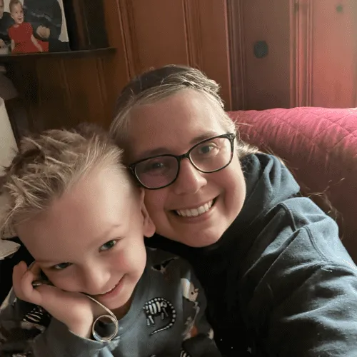 “Professional therapist Chris with grandson, showing a personal and welcoming side to her practice”