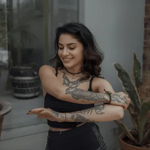 Person smiling and stretching with a calm expression, symbolizing growth, self-confidence, and emotional balance after therapy.