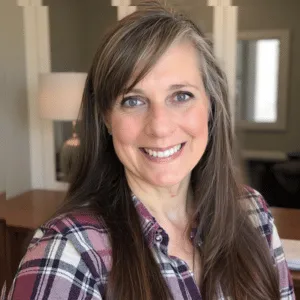 Chris Prebble, Licensed Professional Counselor, smiling warmly in her office, representing compassionate ADHD assessment for children and teens via secure telehealth in Pennsylvania.