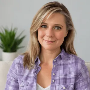 Therapist Christine Prebble smiling warmly in a calm, welcoming office, wearing a soft purple plaid shirt — representing compassionate, down-to-earth online therapy for high-achieving teens and adults in Pennsylvania, Florida, and South Carolina.