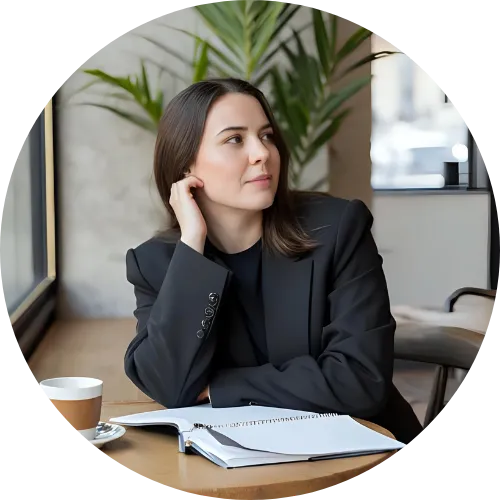 Professional considering next steps over coffee, looking right