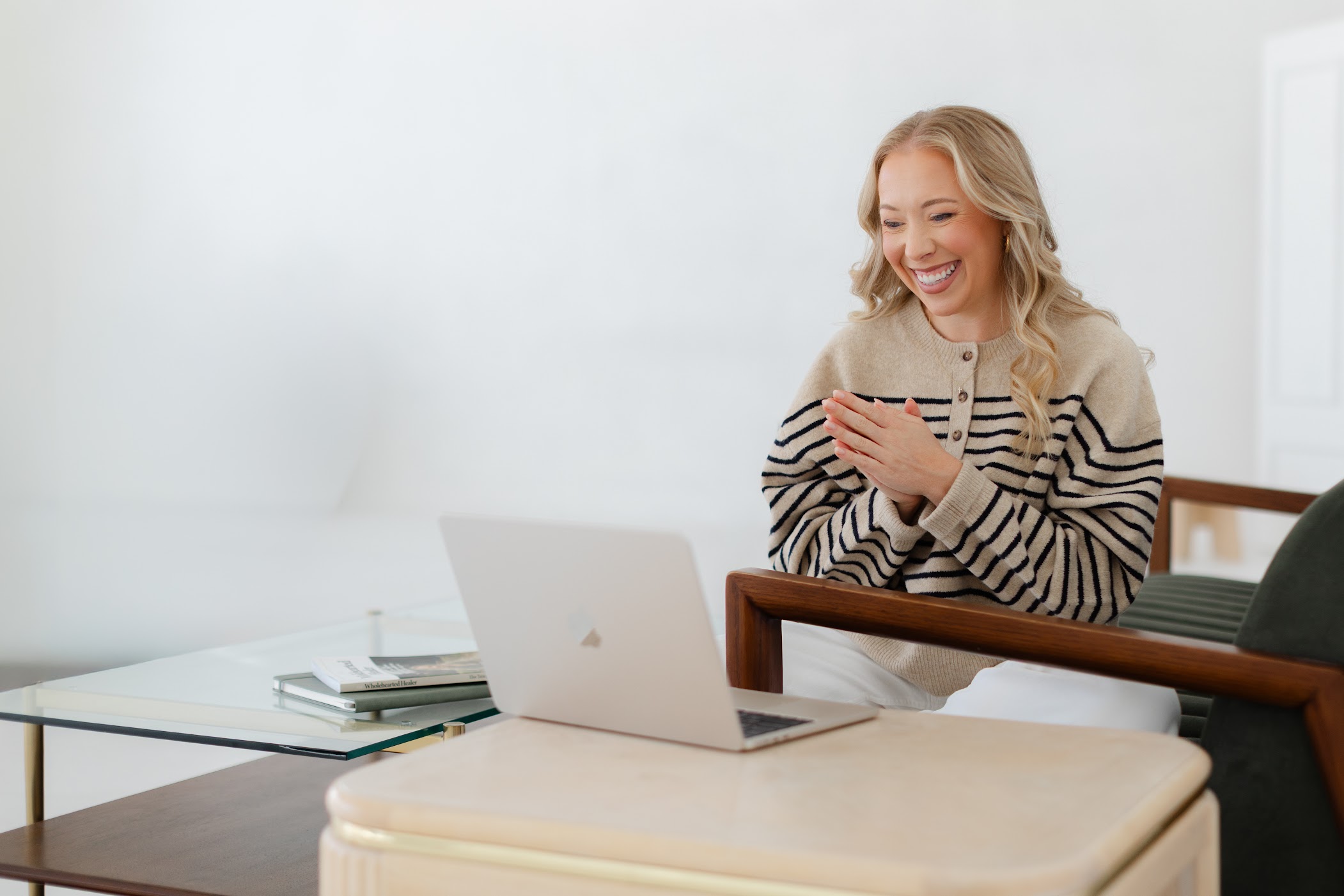 short-haired black cat besides brown wooden table