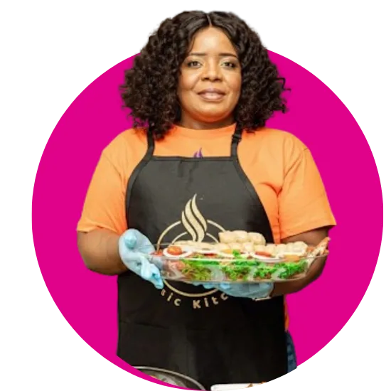 A dark Female chef holding a bowl of salad