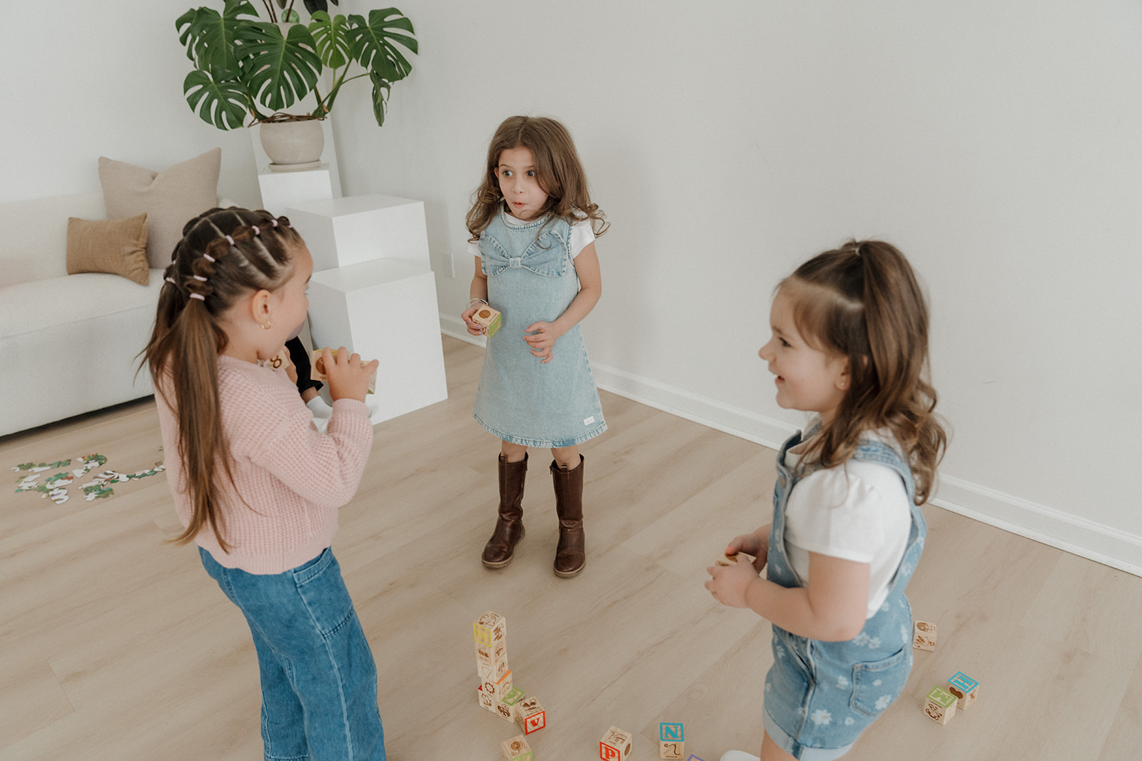 Kids moving with the teacher on a large screen TV