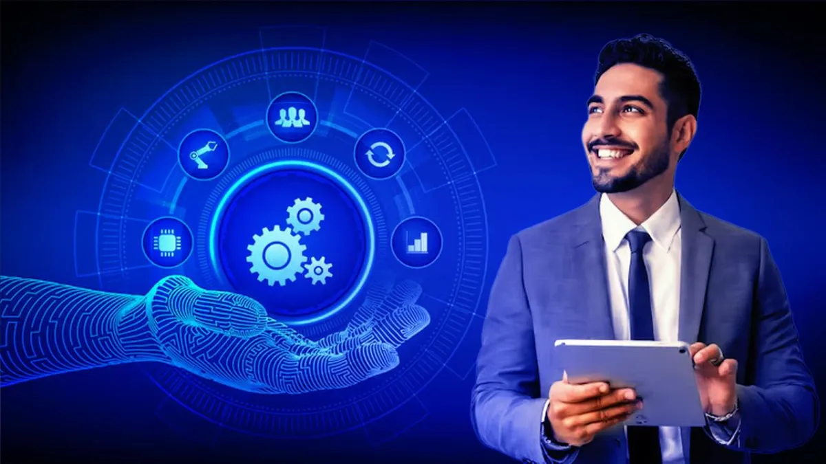 Smiling businessman holding a tablet beside a blue automation graphic with robotic hand, gears, and workflow icons.