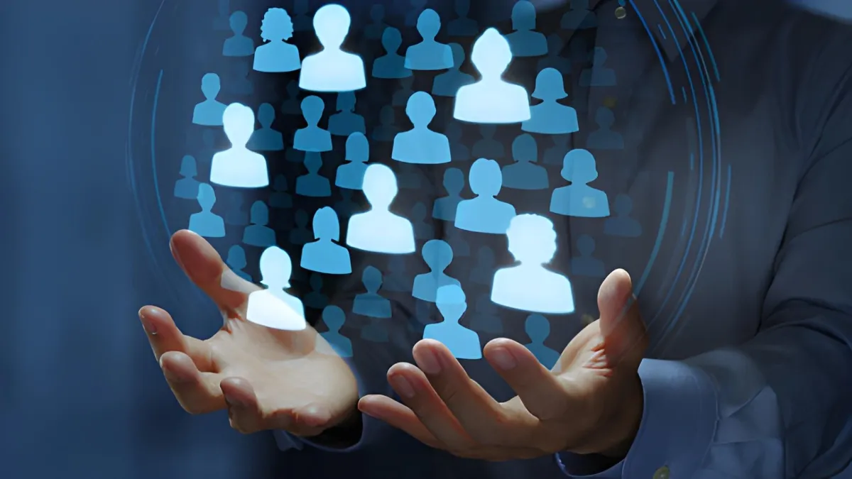 Glowing audience icons above hands representing customer or community growth.