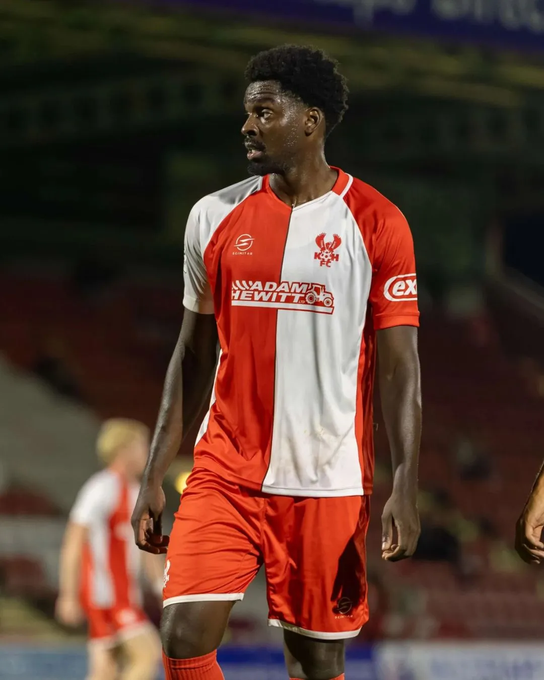 Rotherham Titans player breaking out of a rugby tackle
