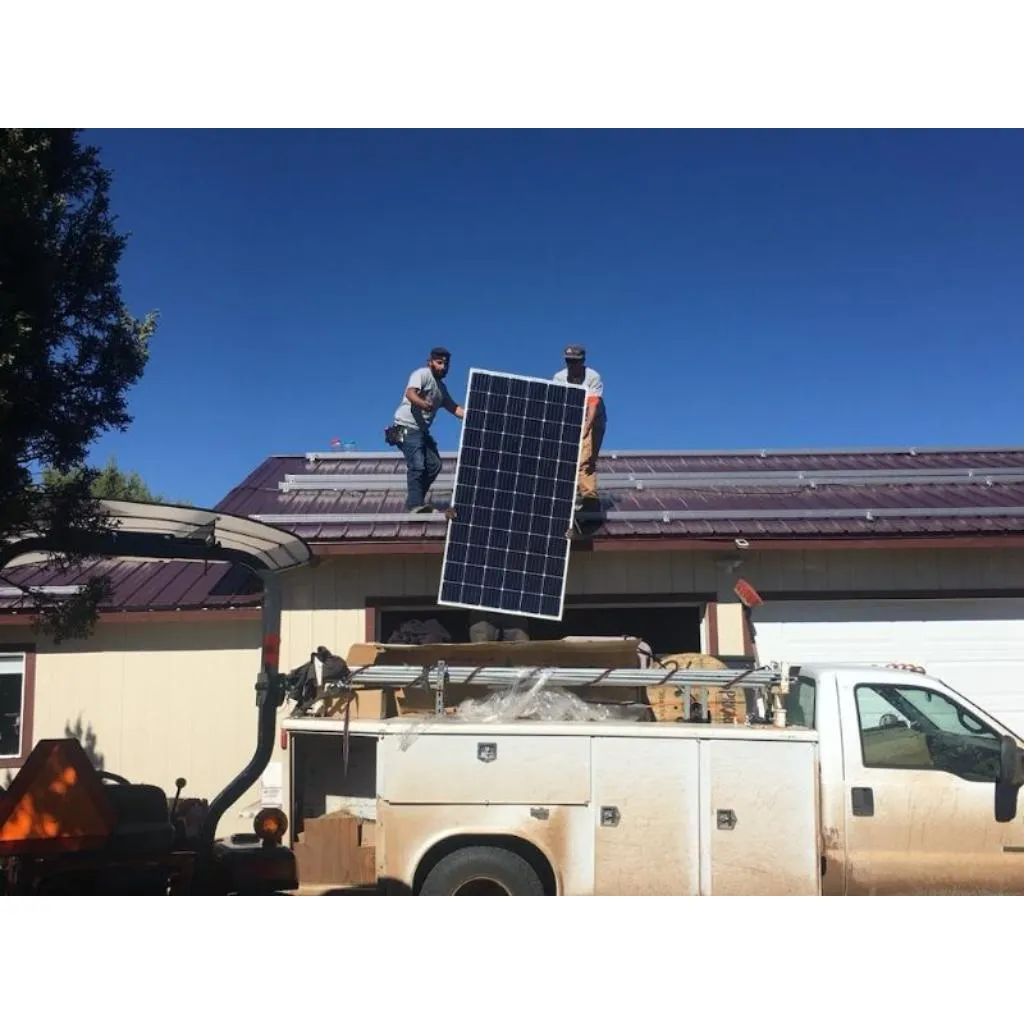 White Mountains Solar crew installing 32 solar panels for a 12kW hybrid inverter and lithium battery system