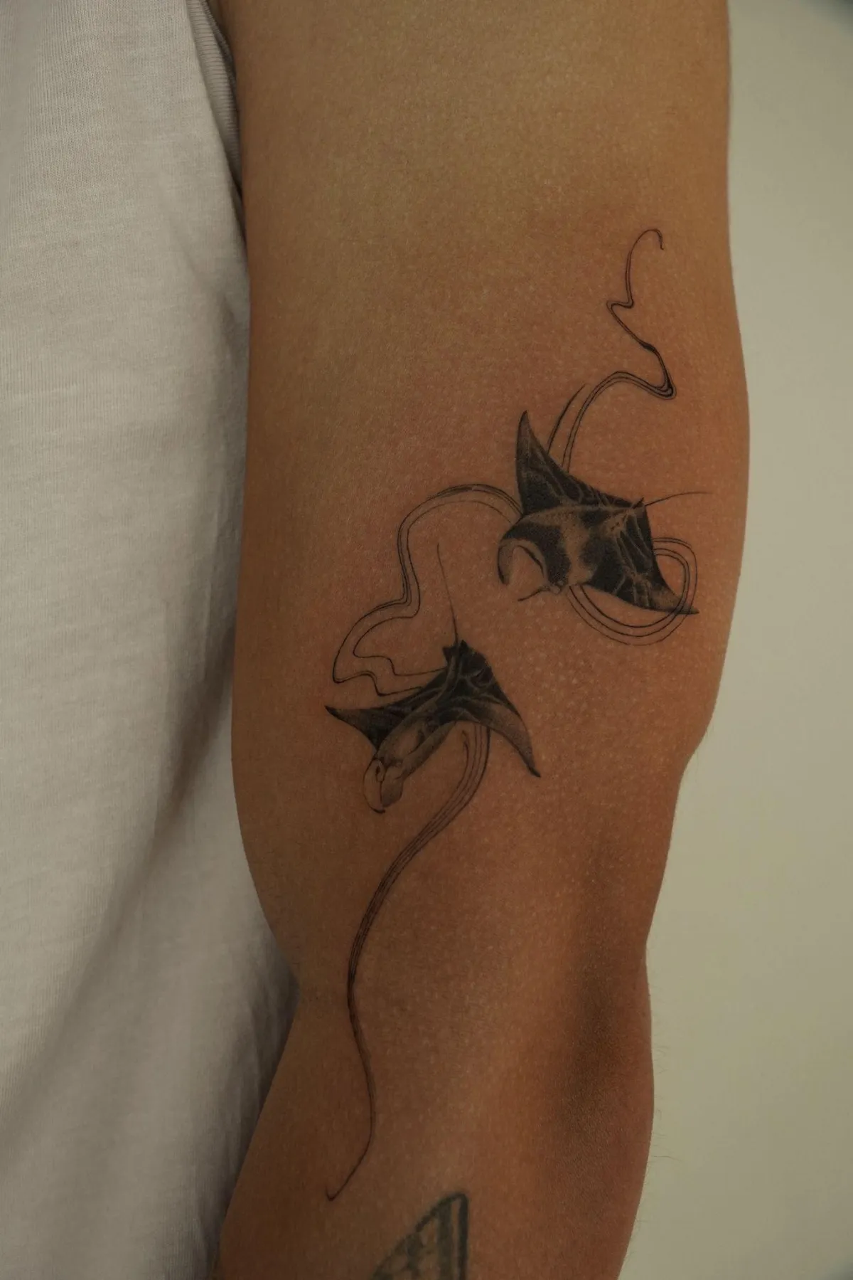 person with tattoo on right arm