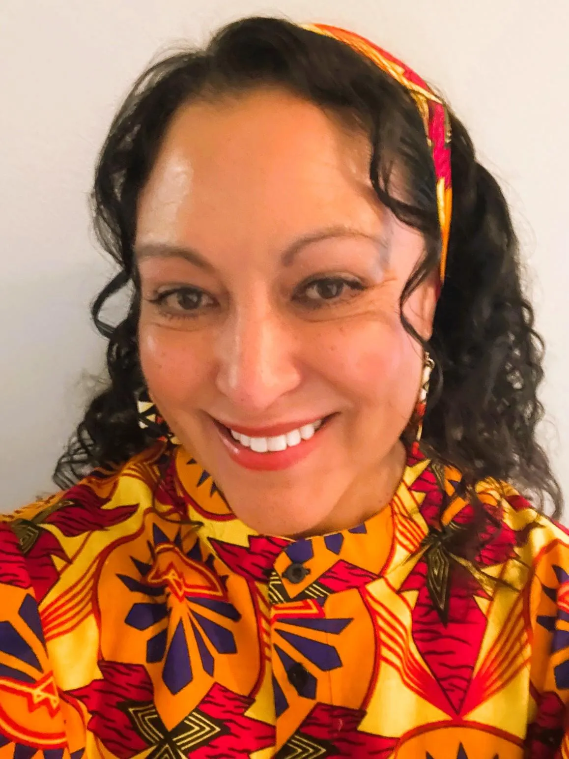 short-haired black cat besides brown wooden table