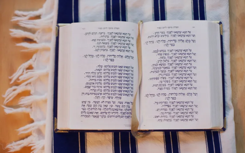Open Hebrew book illustrating The Power of Sukkot workshop