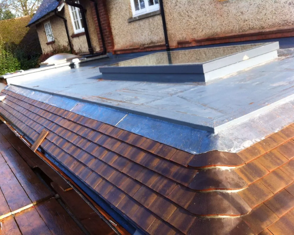 A photo of the leadwork, tiles and skylight we put on a house extension.