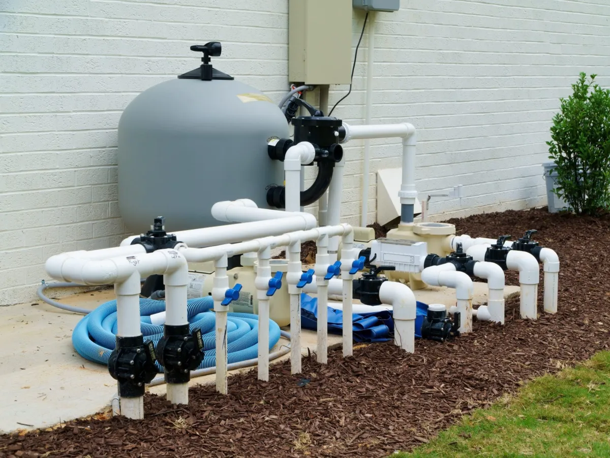 "Newly installed pool equipment, including pump and filter, ensuring efficient water circulation and crystal-clear swimming conditions."