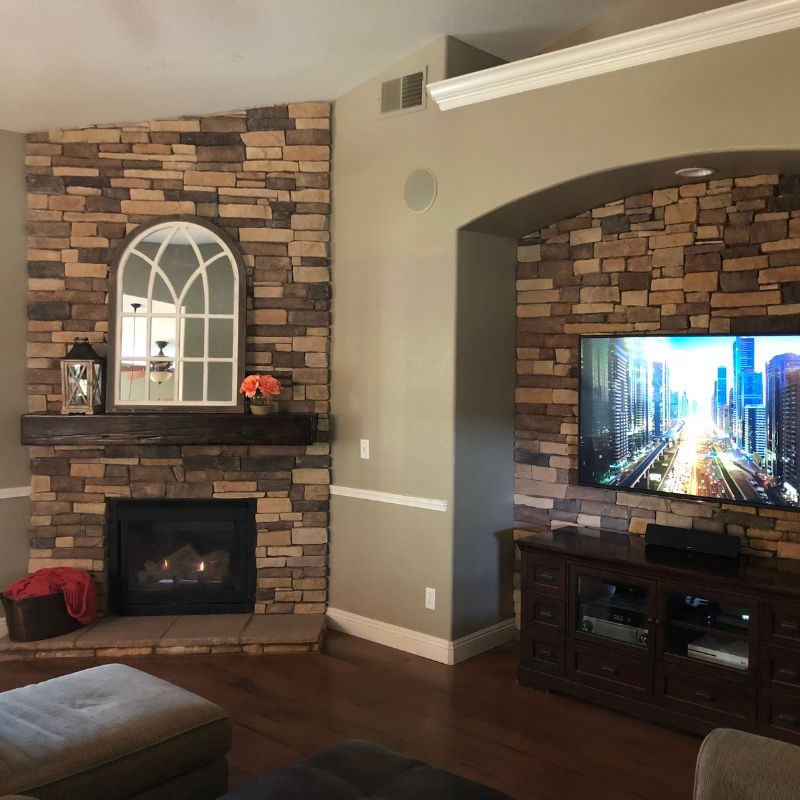 Custom stone fireplace surround and hearth masonry installation in Raleigh NC living room