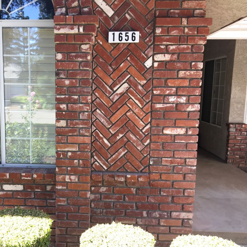 Traditional brick veneer accent wall installation on Raleigh NC home exterior facade
