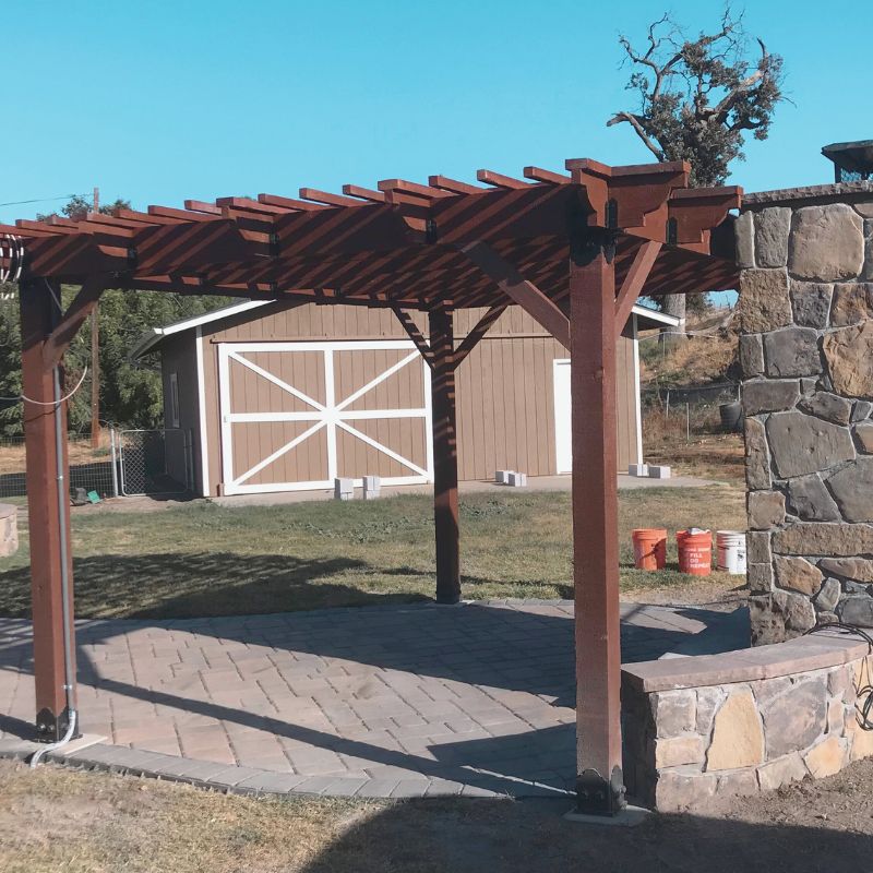 Custom wood pergola providing shade over patio outdoor living space in Raleigh backyard