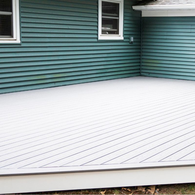 Low-maintenance Trex composite deck installation with modern railing in Wake County NC