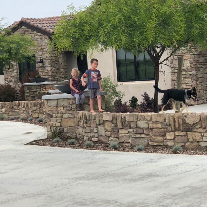 Built-in masonry seating wall surrounding fire pit maximizing patio space in Wake County