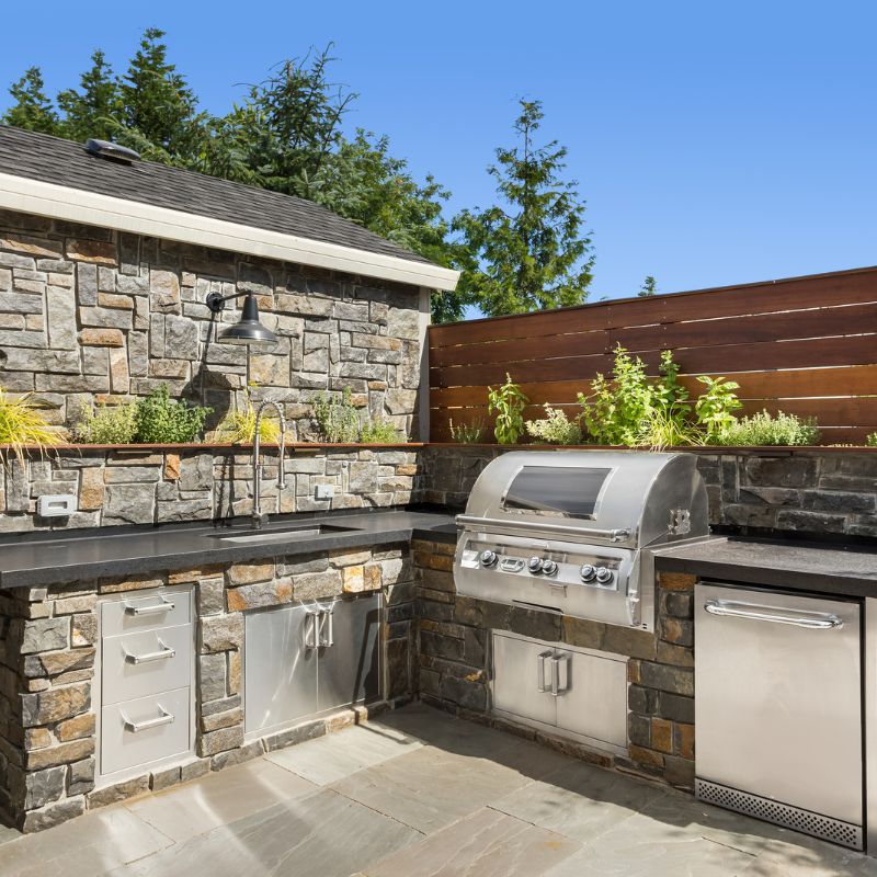 Fully equipped outdoor kitchen with grill countertops and refrigeration in Wake County NC