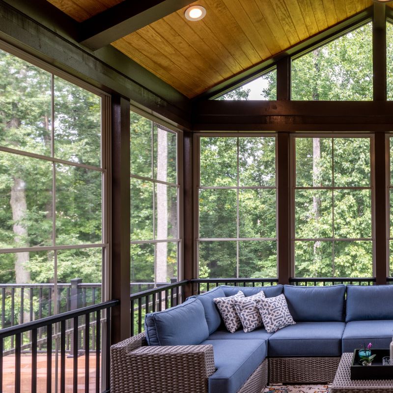Enclosed screened porch addition providing bug-free outdoor relaxation space in Raleigh