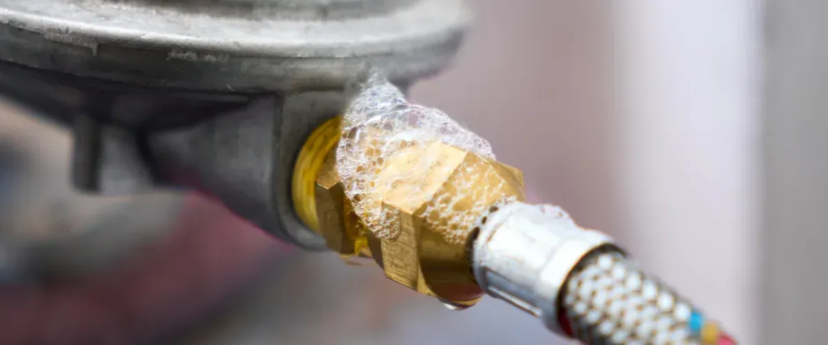 Gas connector fitting leaking with visible bubbles during leak test