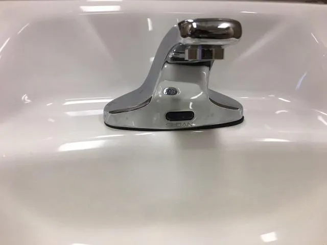 Close-up of a repaired toilet fixture