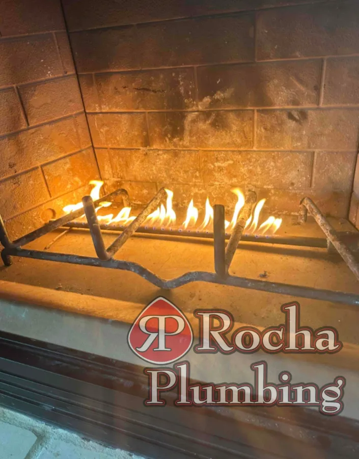 Gas log fireplace installation for indoor heating by Rocha Plumbing