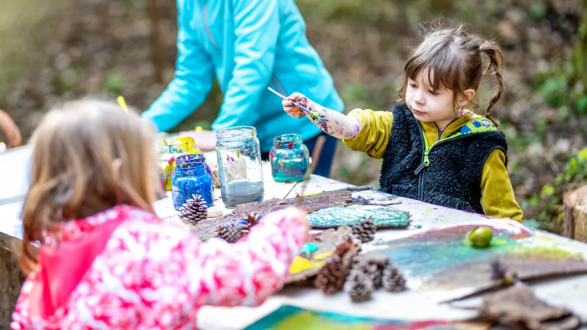 Girl follows directions during arts and crafts time.