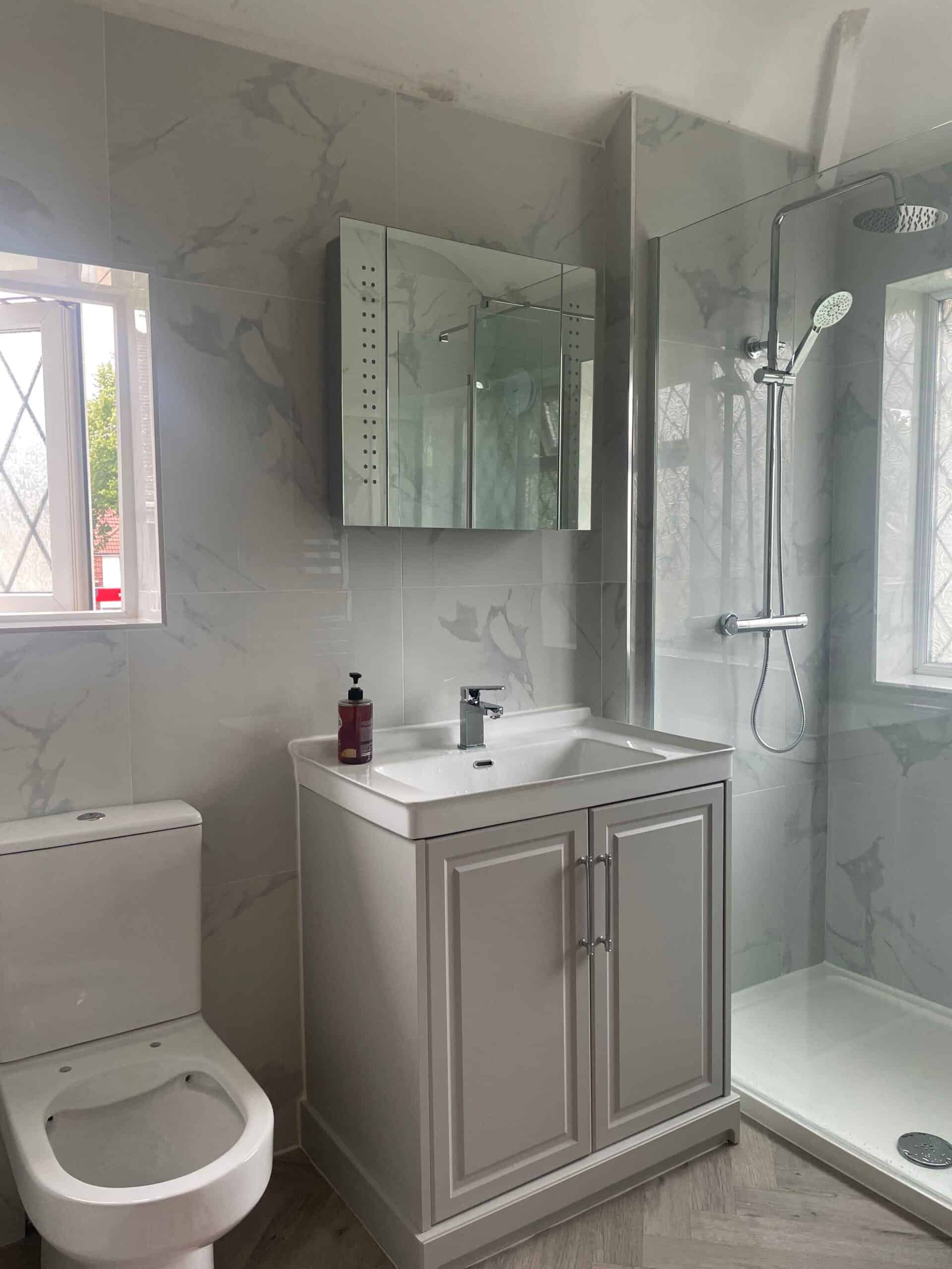 Bathroom Renovator Birmingham - Apple Solutions team completing a wet room installation