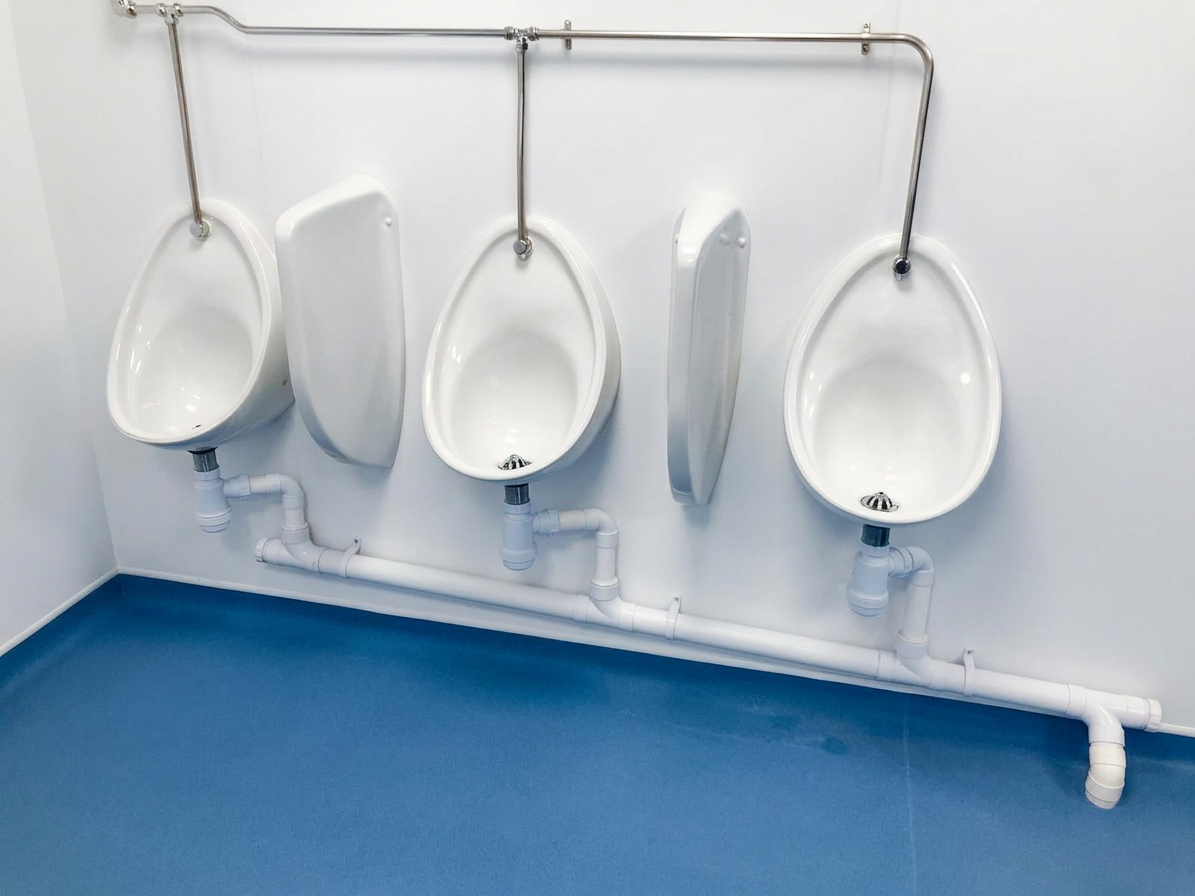 Washroom Refurbishment Birmingham - newly fitted commercial washroom with hygienic wall panels