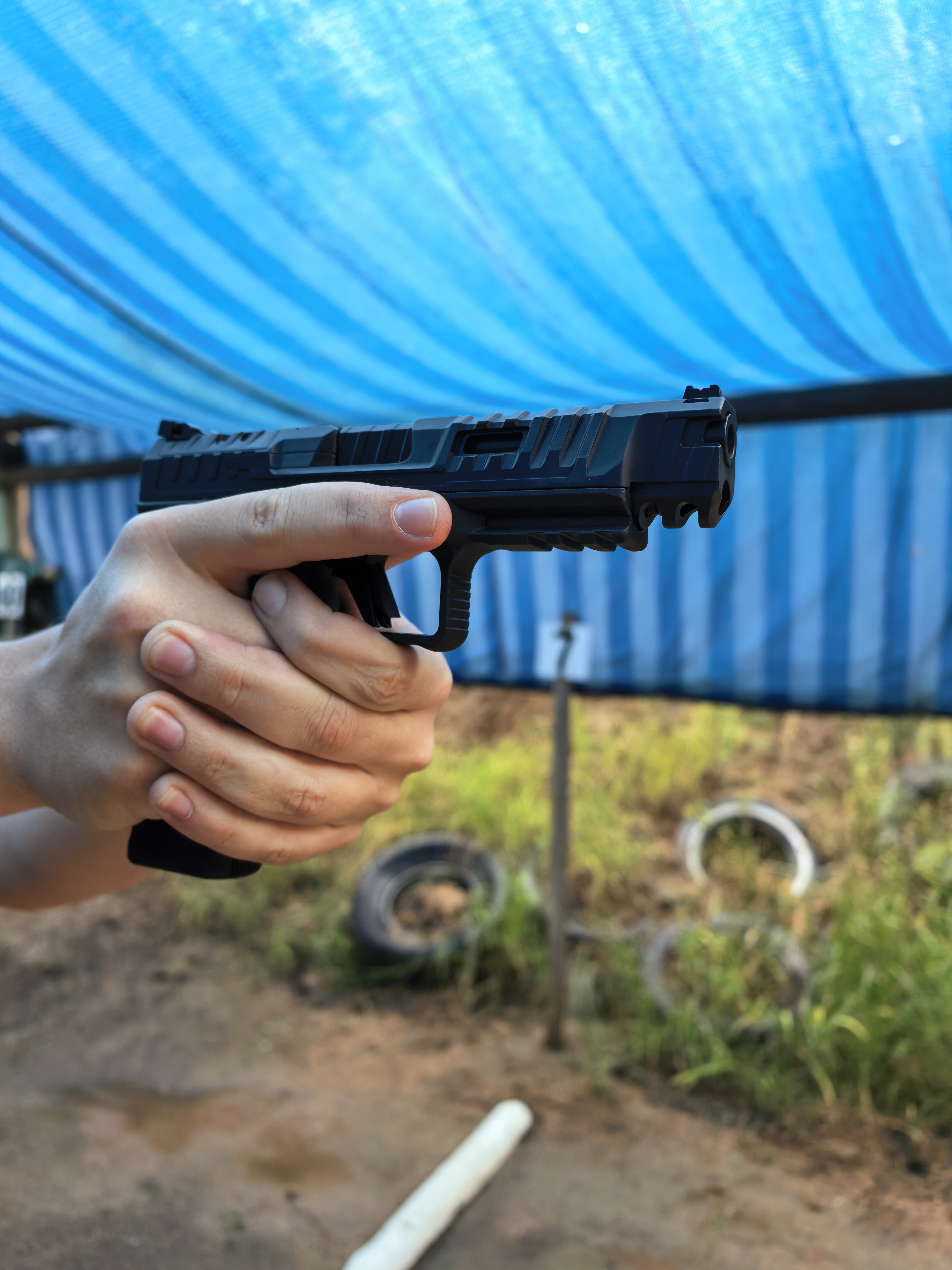 Instructor guiding a shooter safely on the range
