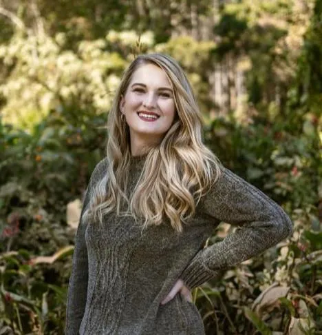 Woman experiencing a glowing, peaceful self-care moment