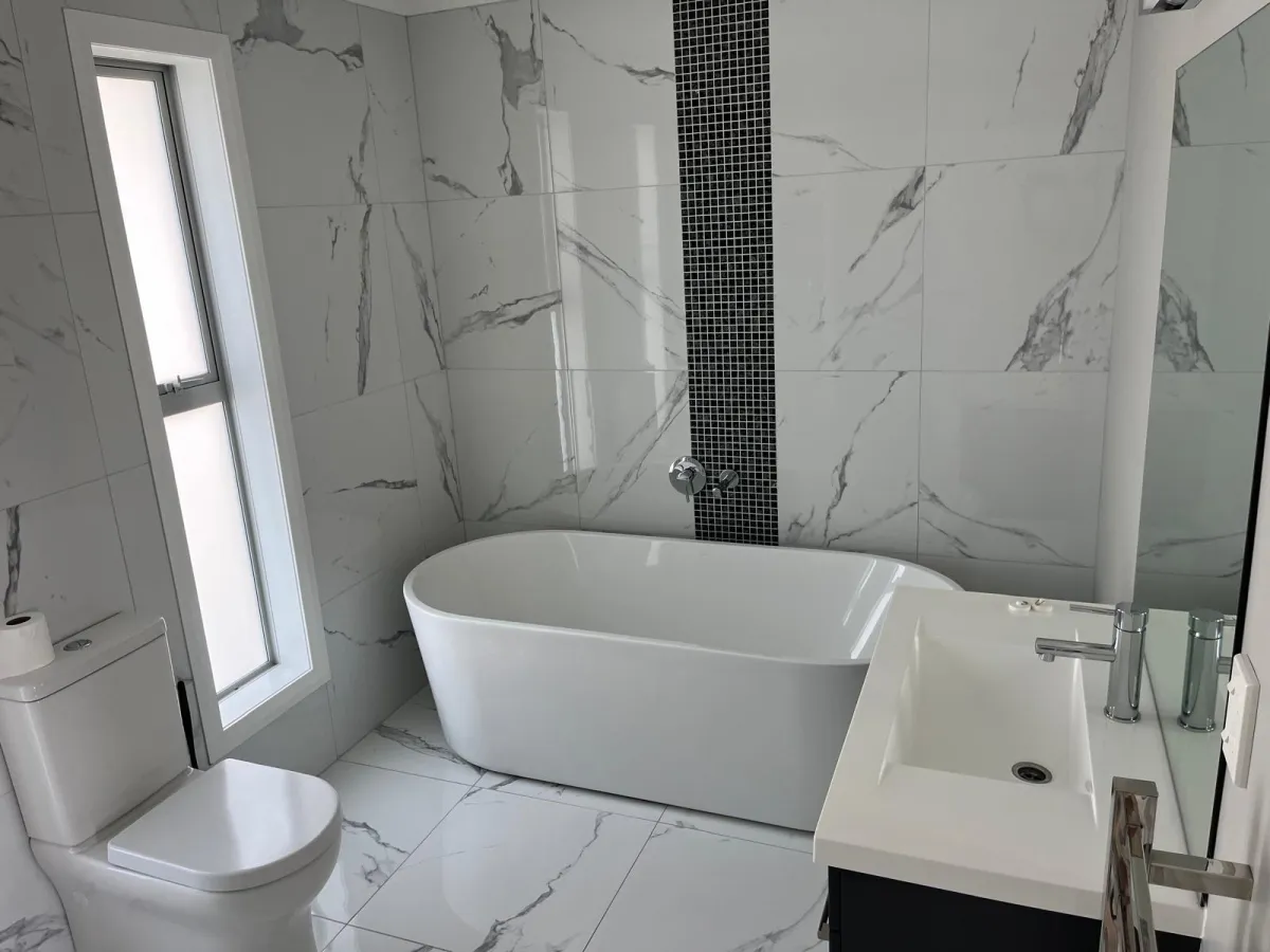 Professional cleaner using eco-friendly products in Auckland office