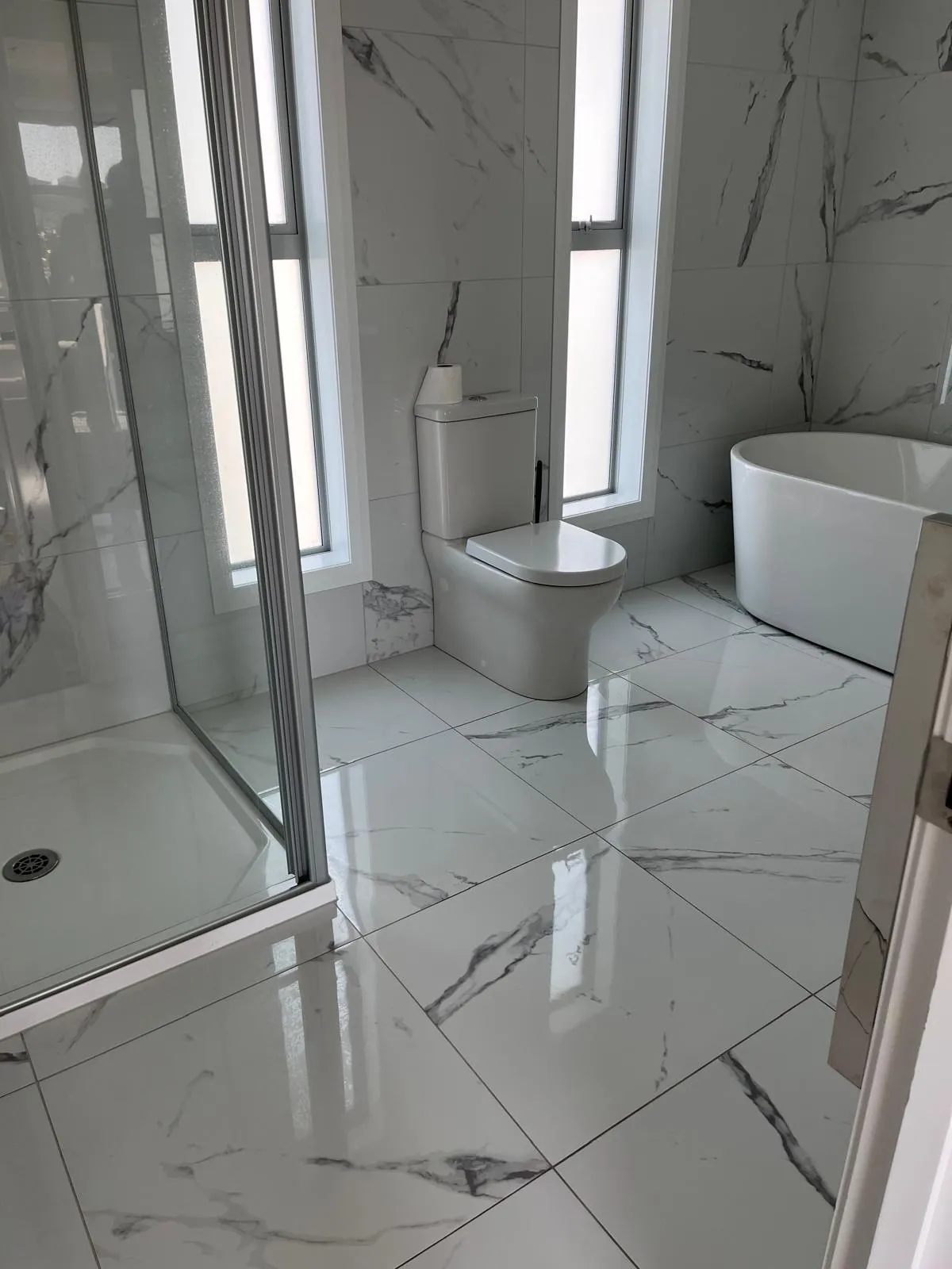 Professional cleaner using eco-friendly products in Auckland office