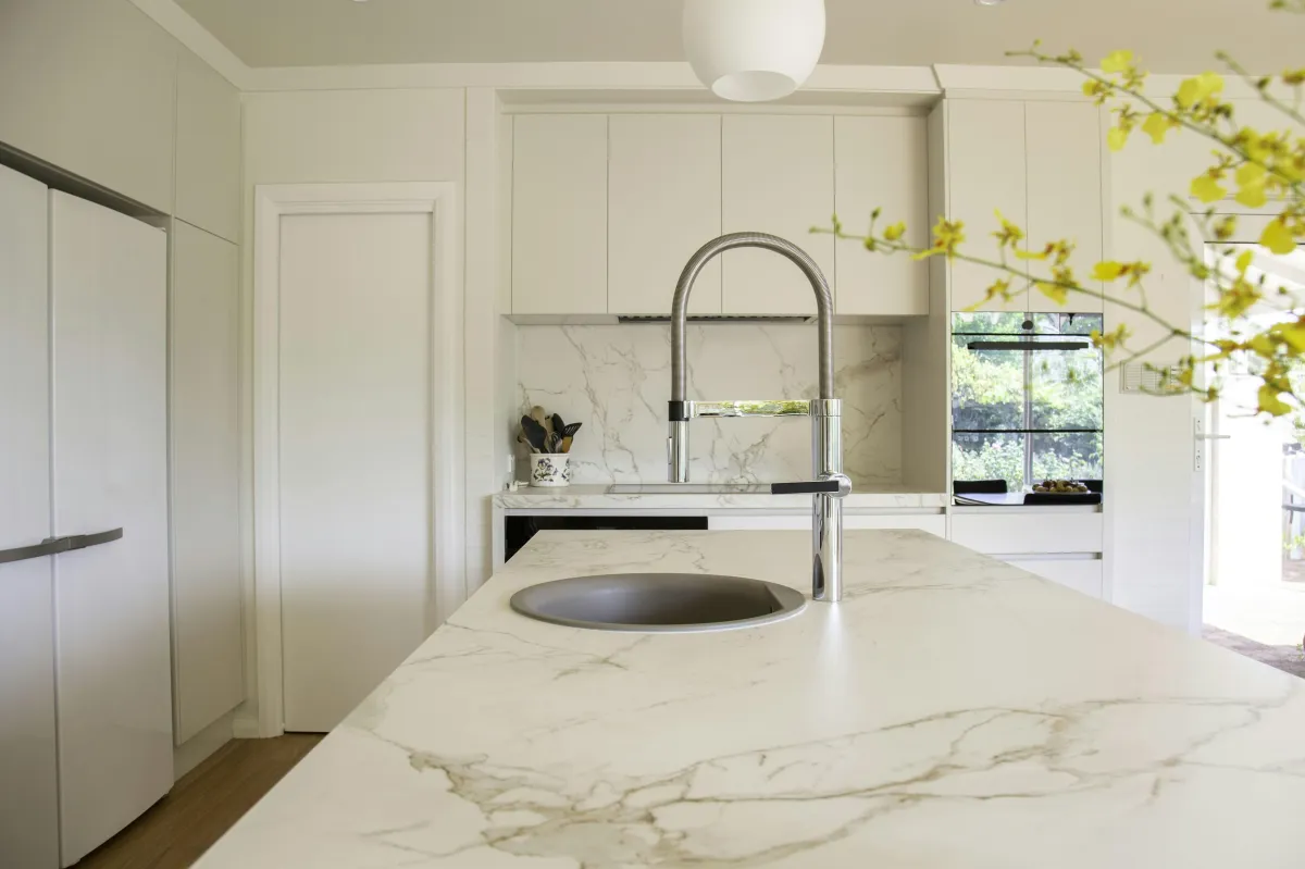Quartzite countertop installed in a stylish home kitchen