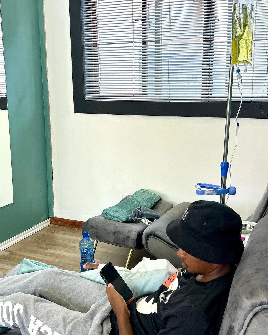 person holds plastic bottle