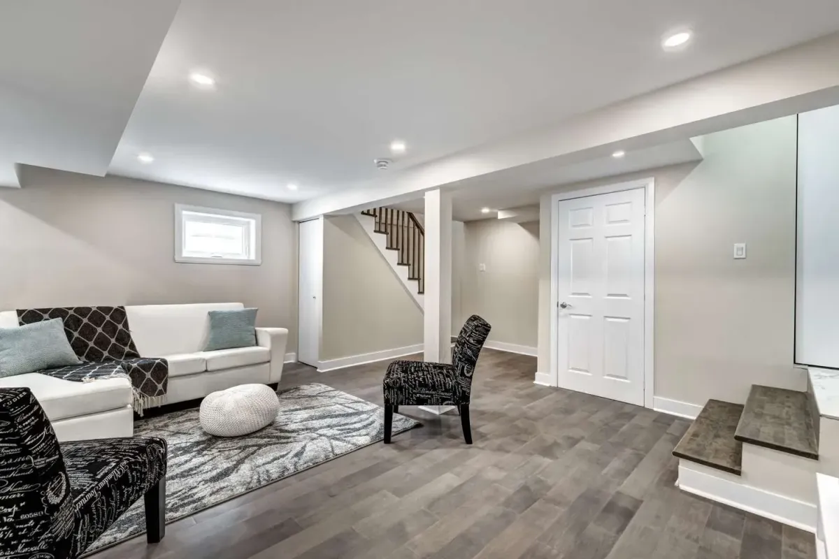 a living room with a white couch and a rug