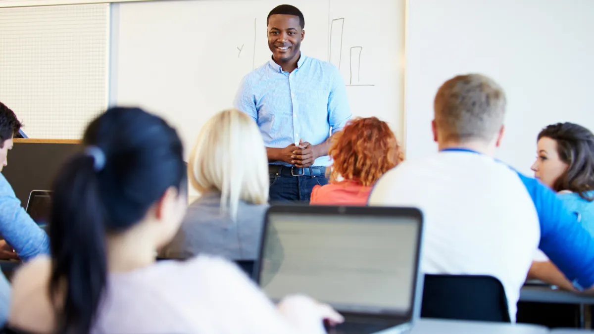 person writing on white paper