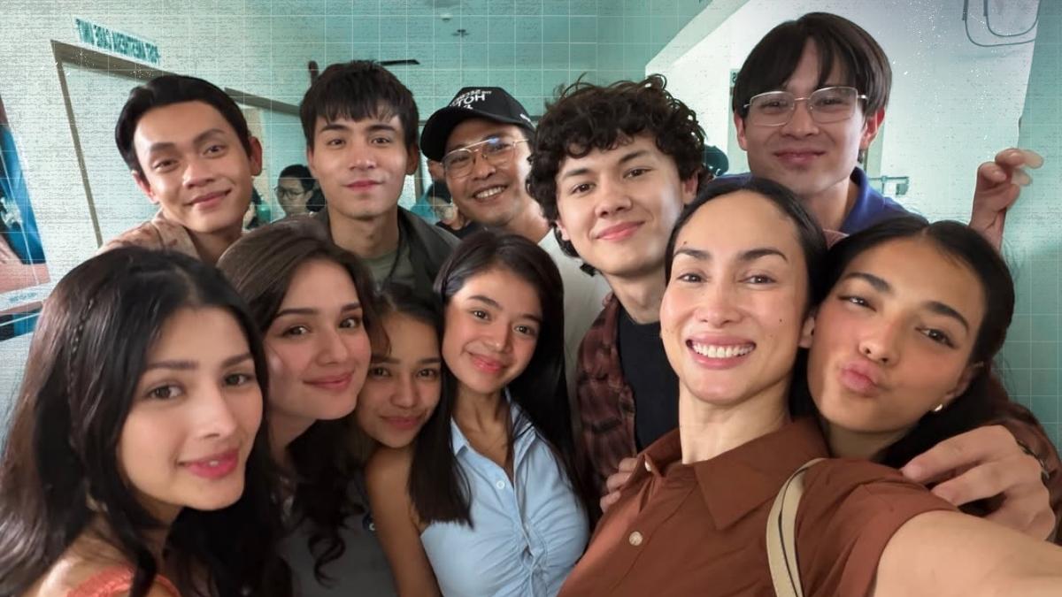 “Ina Raymundo smiling during a taping while interacting with younger co-stars on the set of Secrets of Hotel 88.”